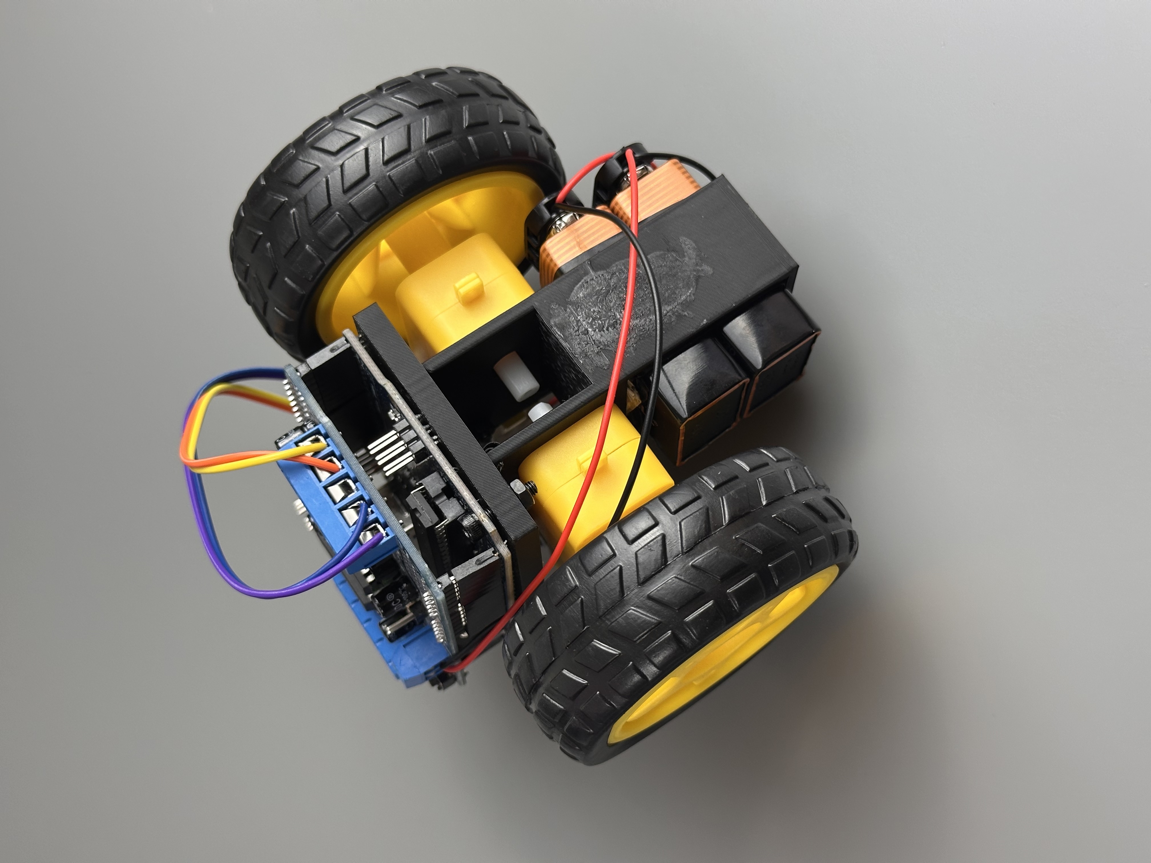 Wheeled drive mechanism, circuit boards, wiring, and battery holder outside the sphere
